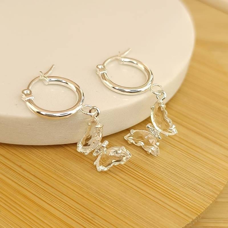 Argollas 🦋 Cristal Transparente en Acero Blanco 🤍